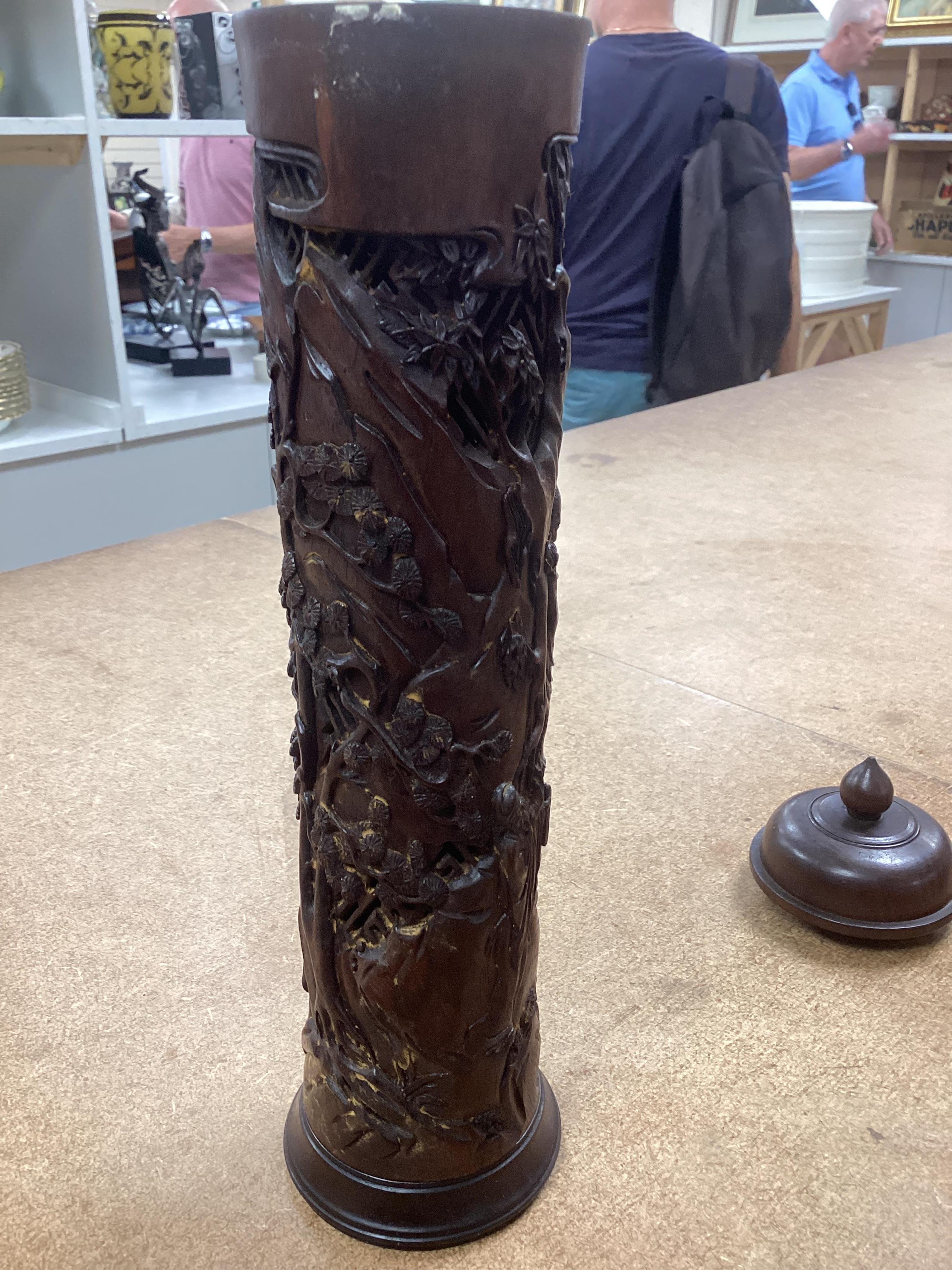 A pair of Chinese hardwood incense holders carved with trees and figures, cased, 29cm high. Condition - good